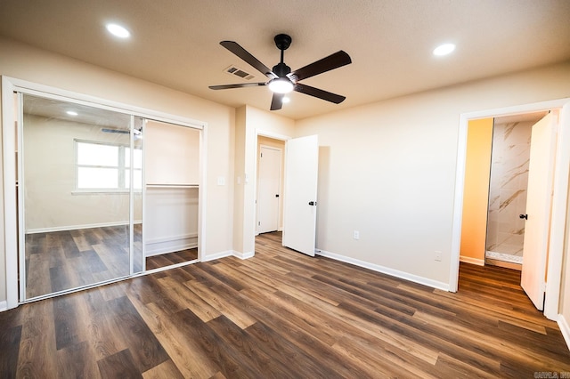 unfurnished bedroom featuring ceiling fan, a closet, and dark hardwood / wood-style floors