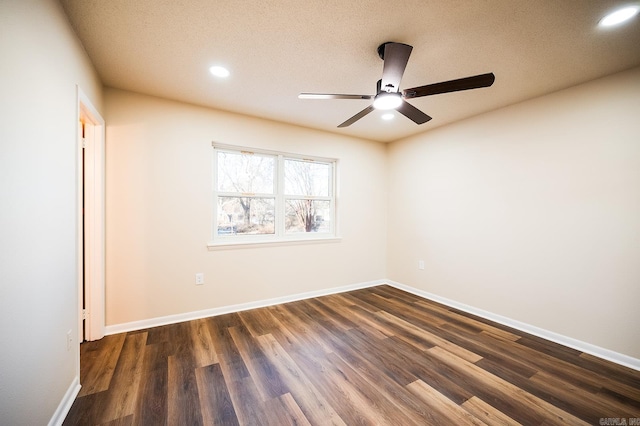 unfurnished room featuring dark hardwood / wood-style flooring, a textured ceiling, and ceiling fan