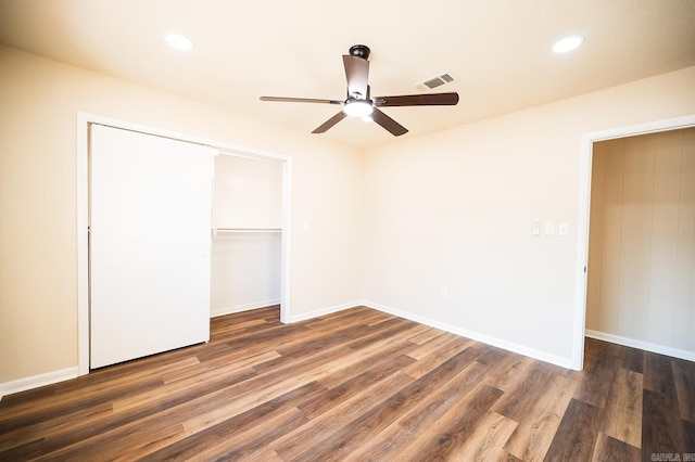 unfurnished bedroom featuring ceiling fan, a closet, and dark hardwood / wood-style floors