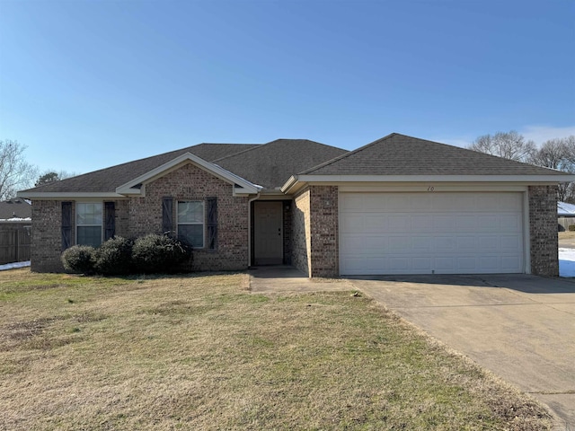 ranch-style home with a front yard and a garage