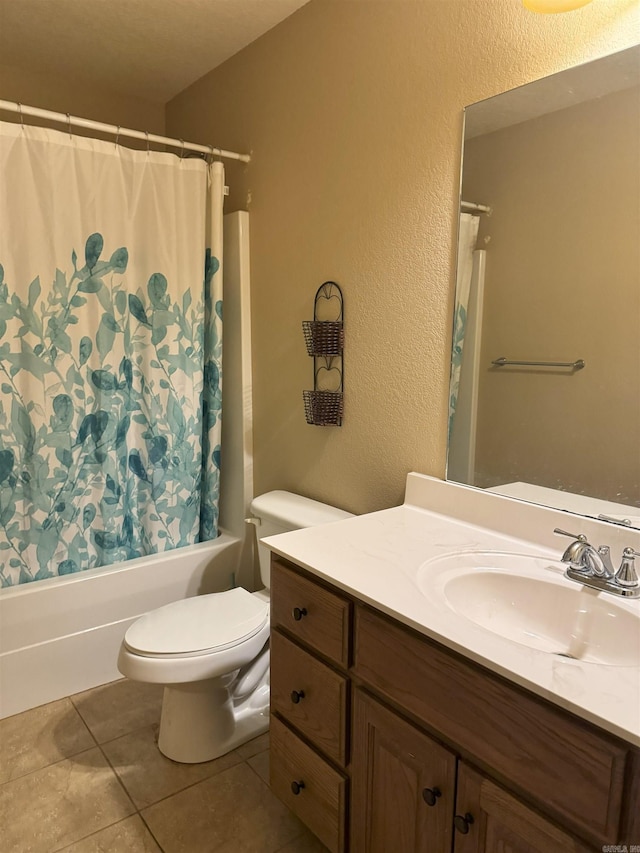 full bathroom featuring toilet, shower / bathtub combination with curtain, tile patterned floors, and vanity