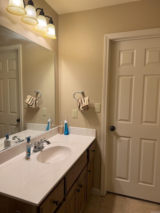 bathroom featuring tile patterned floors and vanity