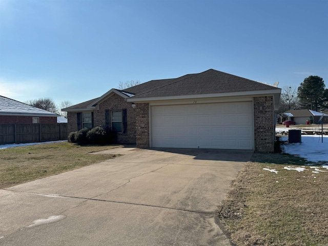 single story home with a front lawn and a garage