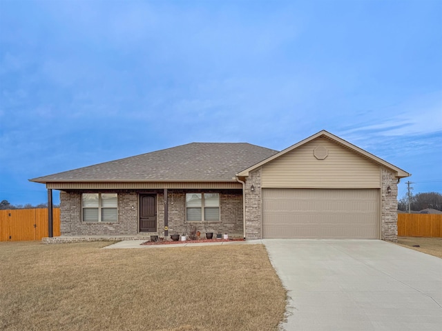 ranch-style home with a front lawn and a garage