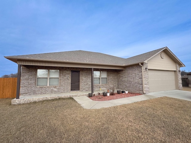 single story home with a front lawn and a garage