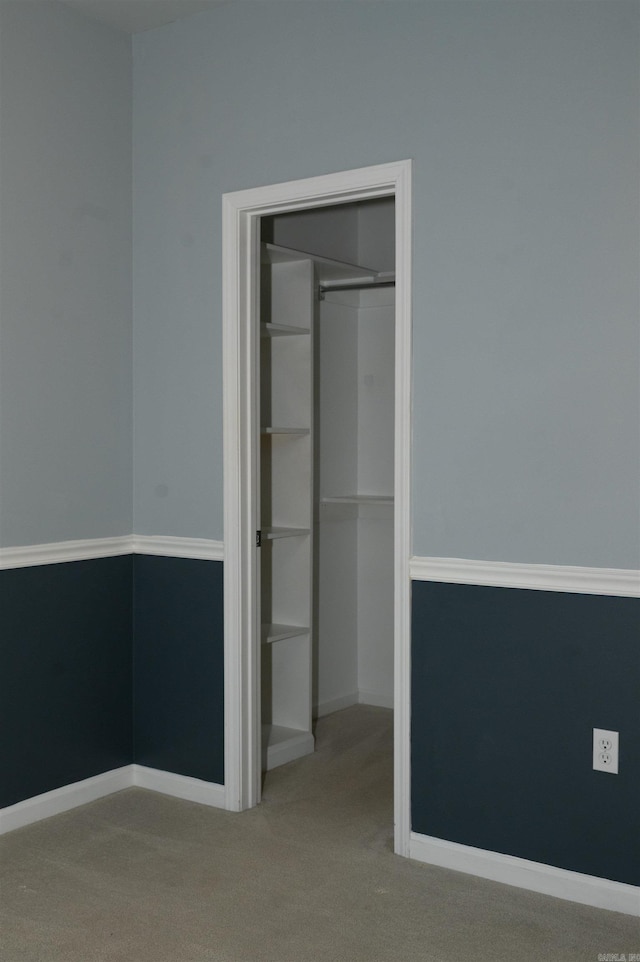 unfurnished bedroom featuring a closet and carpet flooring