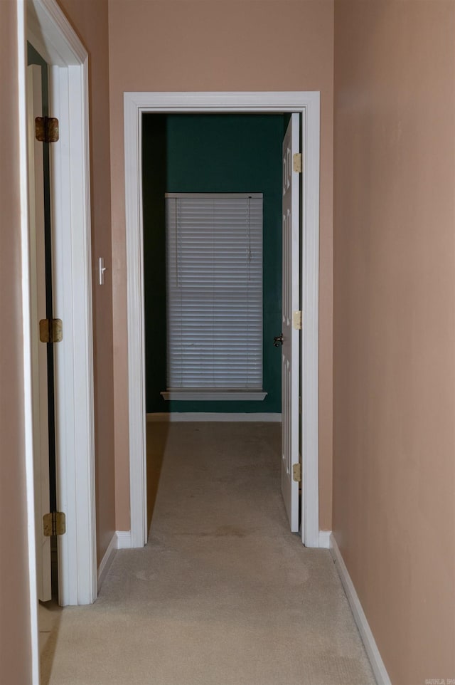 hallway with light carpet