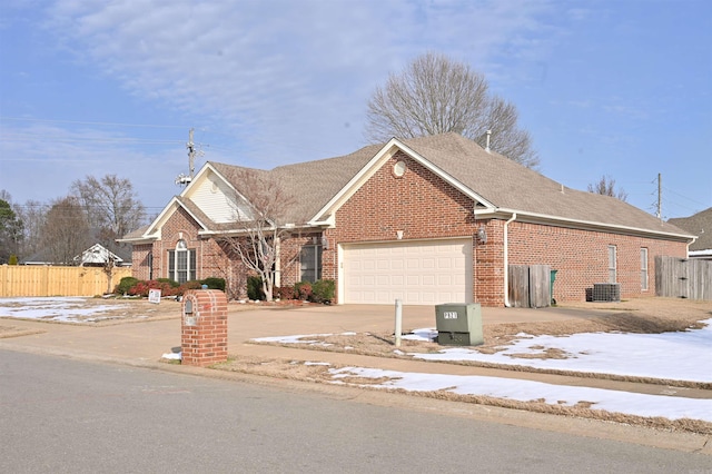 view of front facade with central AC and a garage