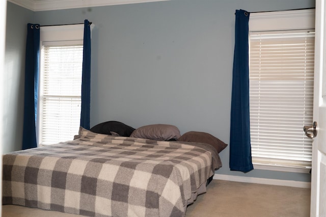 carpeted bedroom featuring ornamental molding