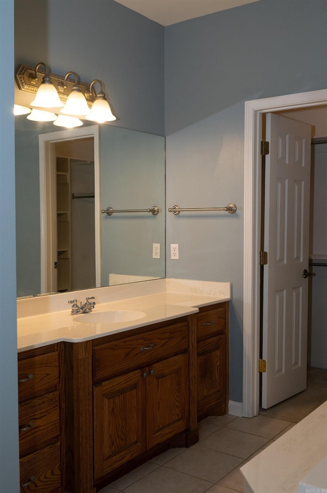 bathroom featuring tile patterned flooring and vanity