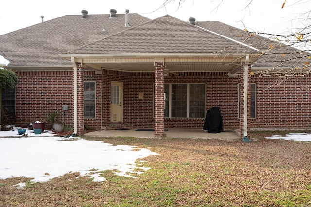 rear view of property featuring a patio