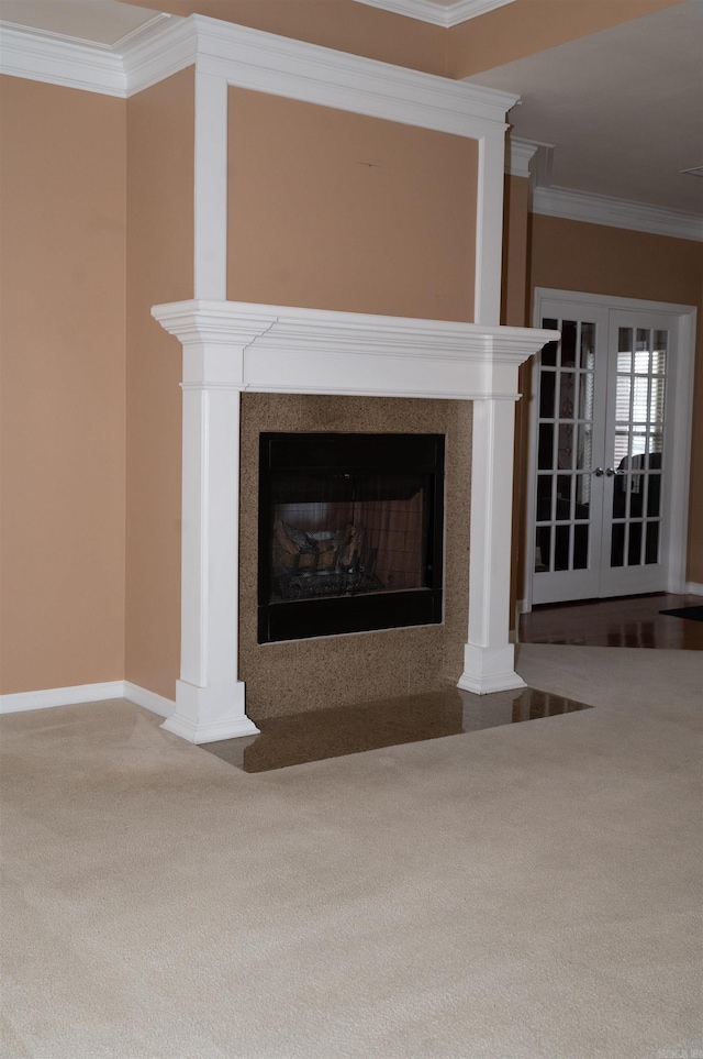 room details featuring carpet floors, french doors, and ornamental molding