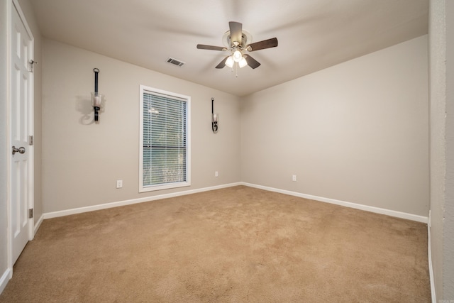 carpeted empty room with ceiling fan