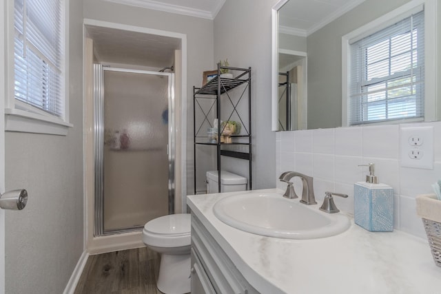 bathroom featuring toilet, wood-type flooring, backsplash, and crown molding