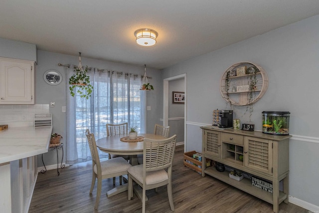 dining space featuring dark hardwood / wood-style flooring