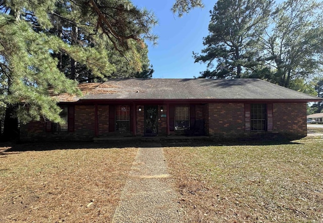 ranch-style home with a front yard