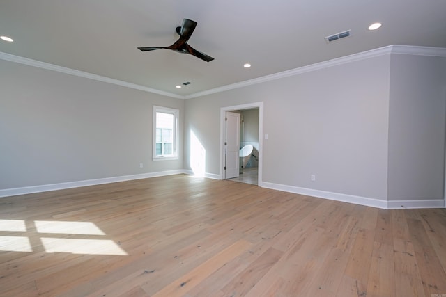 empty room with crown molding, ceiling fan, and light hardwood / wood-style flooring