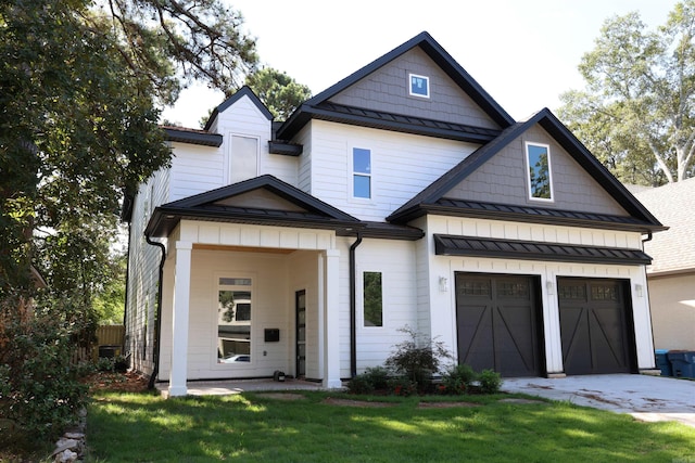 view of front of house with a garage and a front yard