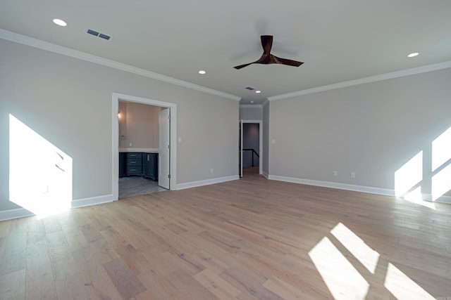 interior space with ornamental molding, ceiling fan, and light hardwood / wood-style flooring