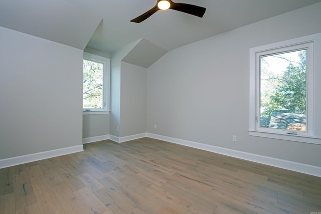 bonus room featuring lofted ceiling, hardwood / wood-style floors, and ceiling fan