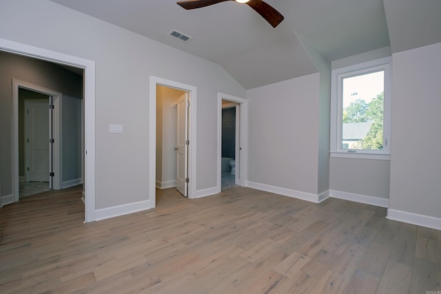 unfurnished bedroom with connected bathroom, ceiling fan, and light hardwood / wood-style flooring