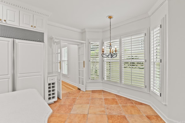 tiled dining space with a chandelier and crown molding