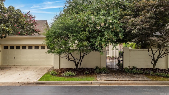 obstructed view of property featuring a garage