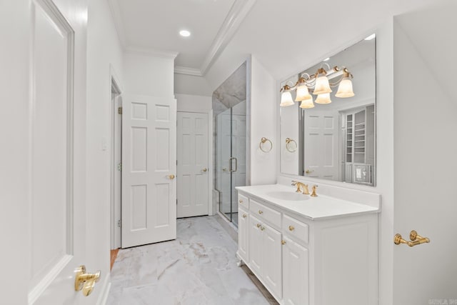 bathroom with vanity, crown molding, and a shower with shower door