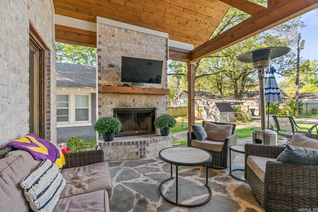 view of patio with an outdoor stone fireplace