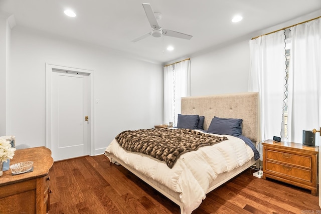 bedroom with ceiling fan and wood-type flooring