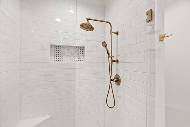 bathroom with tiled shower