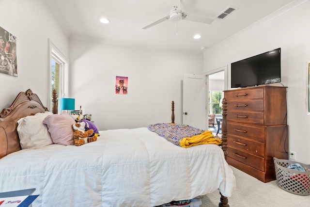 bedroom featuring ceiling fan, crown molding, and multiple windows