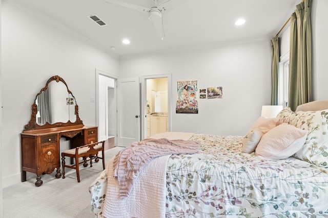 carpeted bedroom featuring ceiling fan and ensuite bathroom