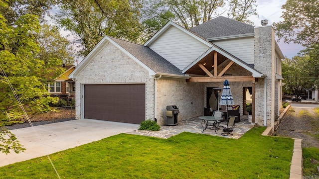 view of front of house with a front yard and a garage