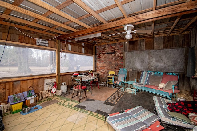 sunroom featuring ceiling fan