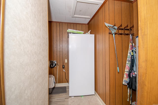 bathroom featuring wooden walls