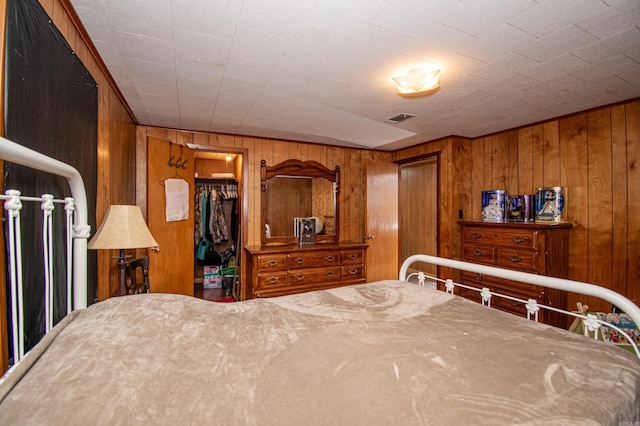 bedroom with wood walls