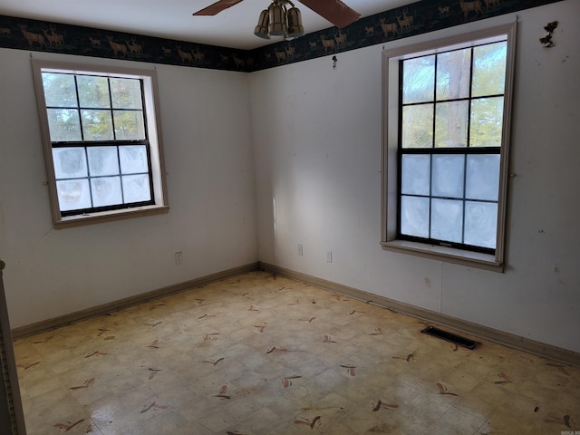 empty room featuring ceiling fan