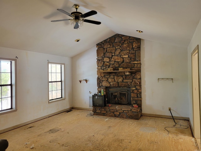 unfurnished living room with ceiling fan and vaulted ceiling