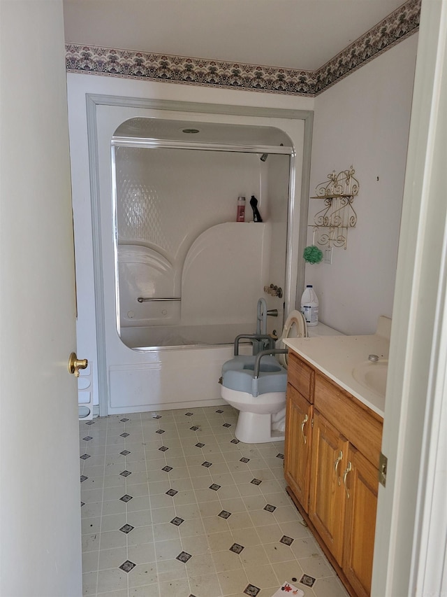 full bathroom with shower / bath combination with glass door, toilet, and vanity