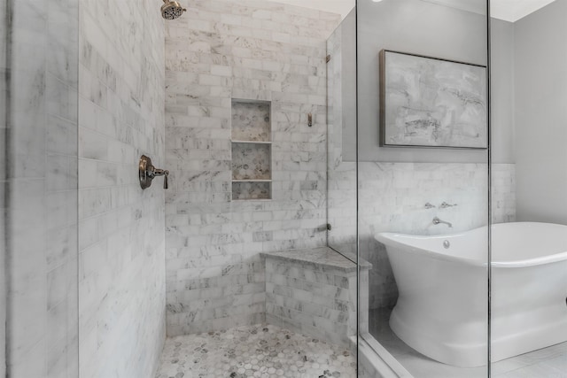 bathroom featuring tile walls and plus walk in shower