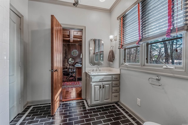 bathroom featuring ornamental molding and vanity