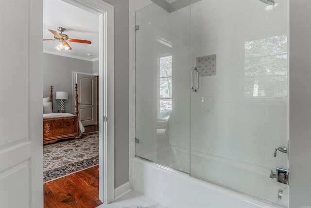 bathroom with shower / bath combination with glass door, ornamental molding, ceiling fan, and wood-type flooring