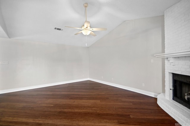 unfurnished living room with lofted ceiling, a fireplace, ceiling fan, and dark hardwood / wood-style flooring