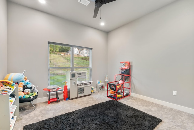 rec room featuring ceiling fan and carpet floors