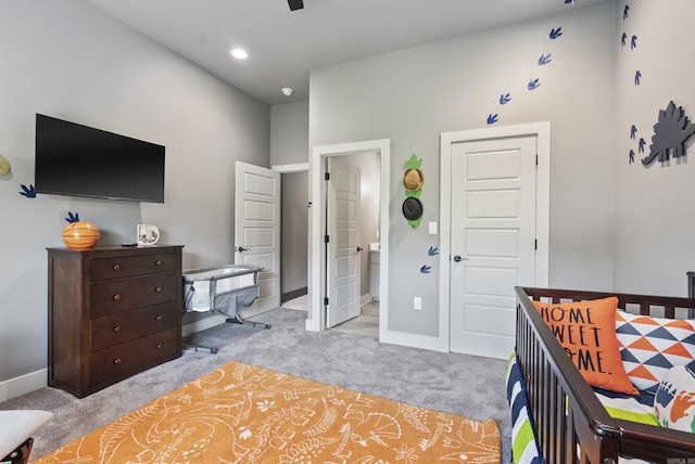 carpeted bedroom featuring ensuite bathroom