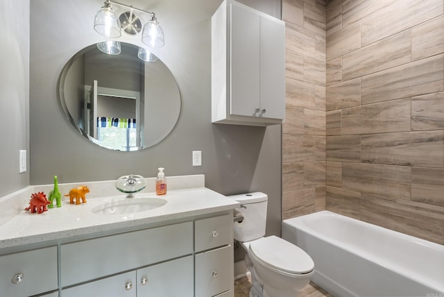 full bathroom with toilet, vanity, and tiled shower / bath combo