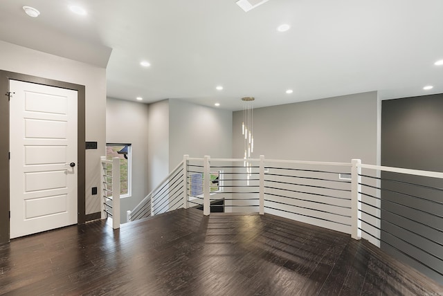 interior space with dark hardwood / wood-style floors