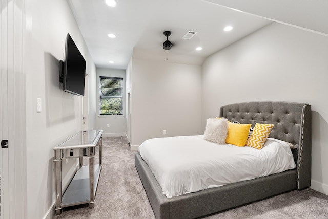 carpeted bedroom with vaulted ceiling