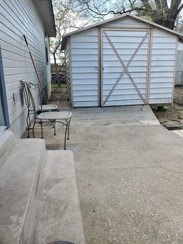 view of patio with a storage shed